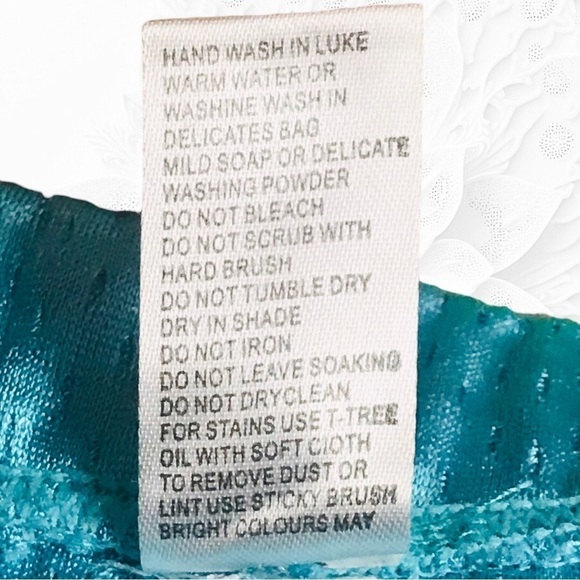 Turquoise Blue Sports Netted Shorts with Black Print - Picture 3 of 4